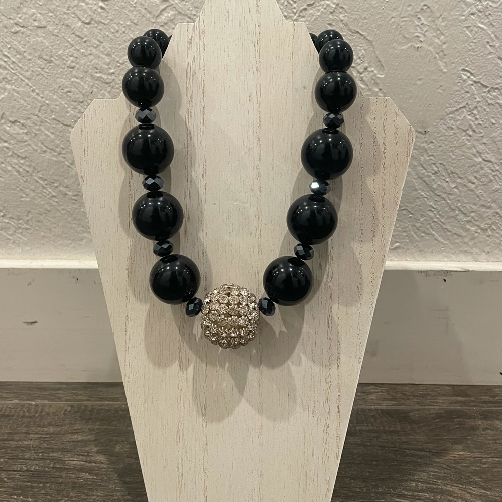 Costume jewelry necklace. Black with rhinestone.